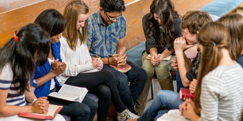 A group of students discussing these principles together, perhaps in a Bible study setting