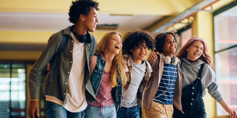 A group of students walking together, symbolizing unity, respect, and a shared journey in Christian education.